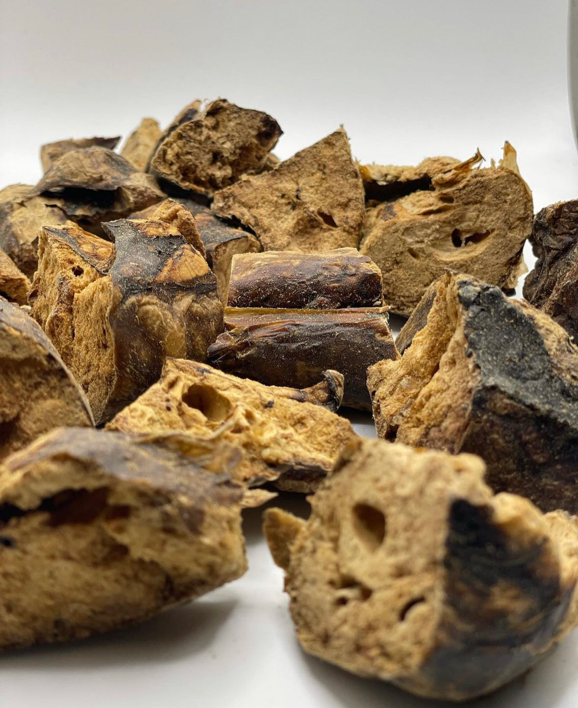 Image of all-natural, single-ingredient buffalo treats for dogs and cats, showcasing the premium quality snacks in a visually appealing arrangement. The treats emphasize their natural ingredients and health benefits for pets.