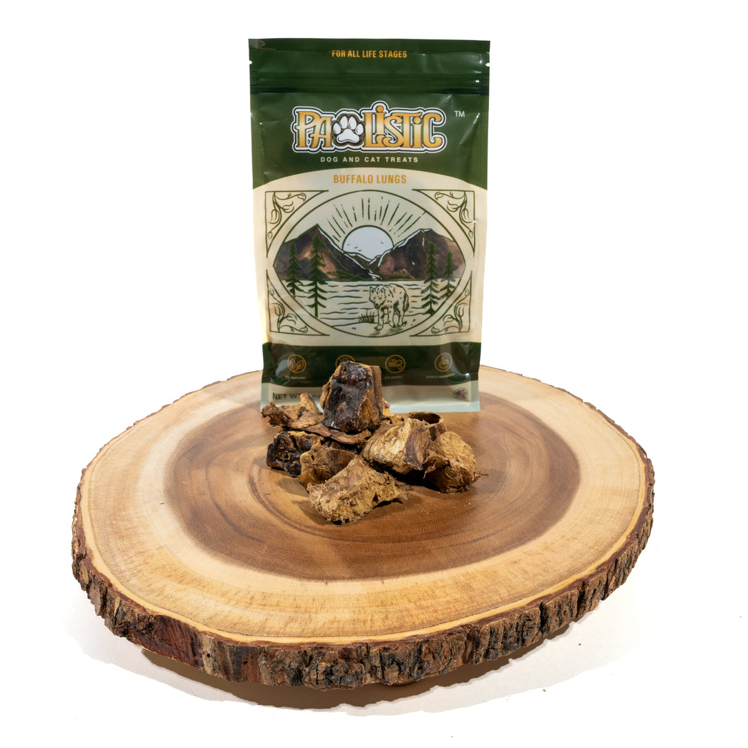 Image of Pawlistic Buffalo Lungs treats for dogs and cats, displayed prominently in front of the packaging. The crunchy pieces of buffalo lung emphasize their all-natural, single-ingredient quality, highlighting the high-protein content and nutritional benefits for pets.