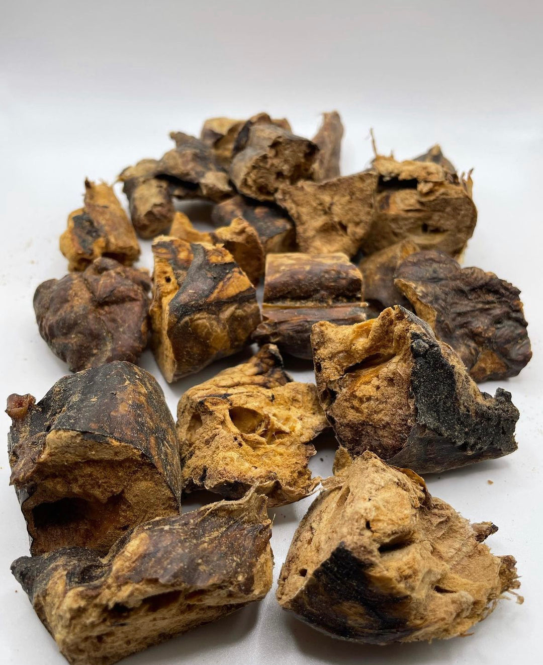 Image of all-natural, single-ingredient buffalo treats for dogs and cats, showcasing the premium quality snacks in a visually appealing arrangement. The treats emphasize their natural ingredients and health benefits for pets.