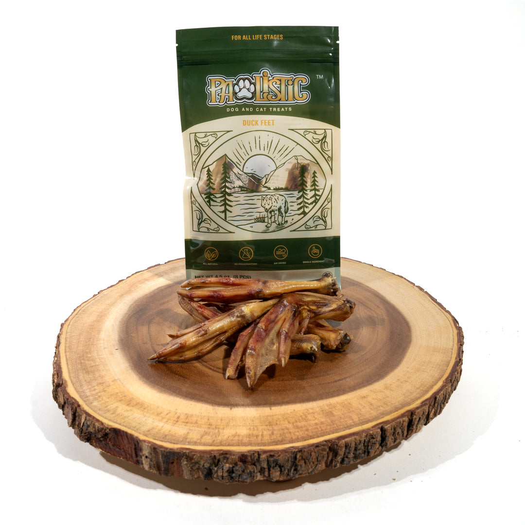 Close-up image of Pawlistic Duck Feet treats next to the packaging. The display highlights the natural, high-protein treats, emphasizing their quality and appealing to pet owners looking for nutritious options for their dogs.